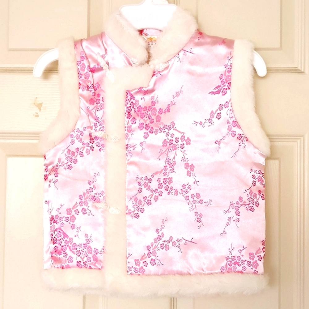 NWOT. Girl's quilted vest trimed with faux fur.